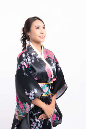 Beautiful attractive asian woman wearing traditional japanese kimono isolated on white backgroundの写真素材