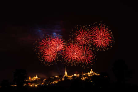 Beautiful colorful fireworks festival over the Phra Nakhon Khiri Historical Park on mountain in night time at Phetchaburi, Thailandの写真素材