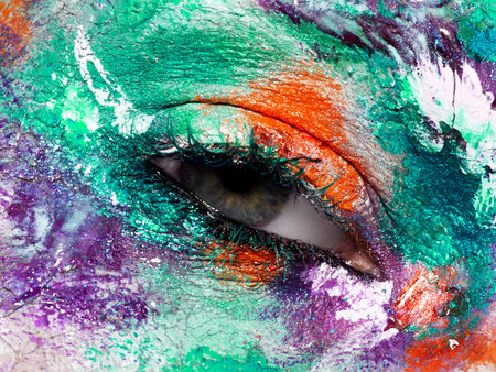 Beauty, cosmetics and makeup. Magic eyes look with bright creative make-up. Macro shot of beautiful...