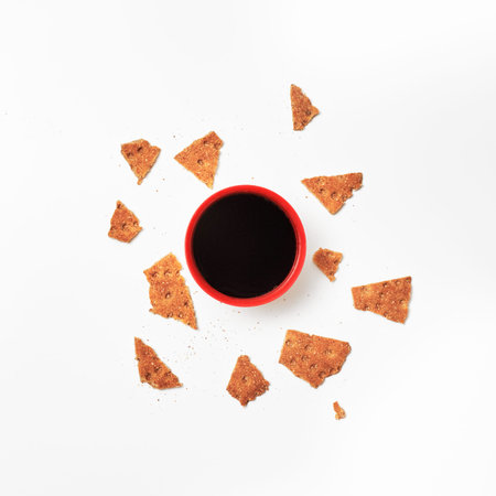 Minimalism. Red cup of coffee or tea among fresh healthy rusks