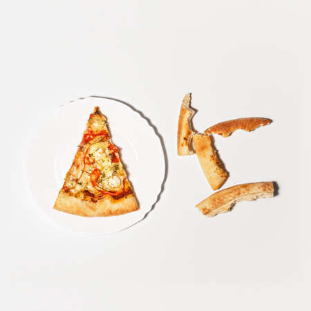 Pizza Margherita just mozzarella and tomato sauce with some fresh basilの写真素材