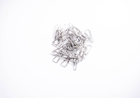 Metal Paper Clips in White Backgroundの写真素材