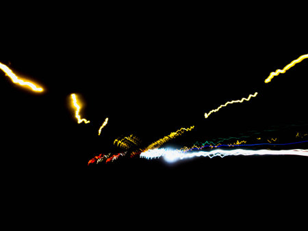 Light on street from car in night