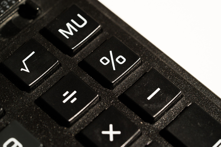 Calculator buttons closeup on white background isolatedの写真素材