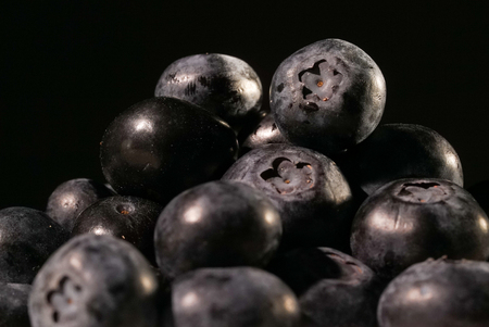 Blueberries on black background close up isolatedの写真素材
