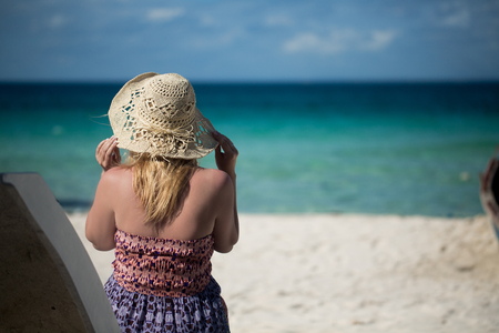 Young sexy blonde woman in beach dress near sea. Girl at the beachの写真素材