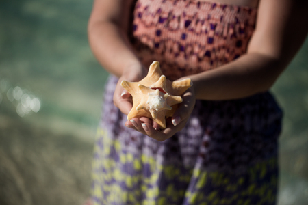 Young sexy blonde woman in beach dress near sea. Girl at the beachの写真素材