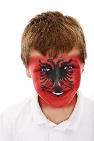 Young boy with albania flag painted on his faceの写真素材