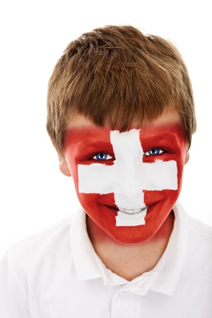 Young boy with switzerland flag painted on his faceの写真素材