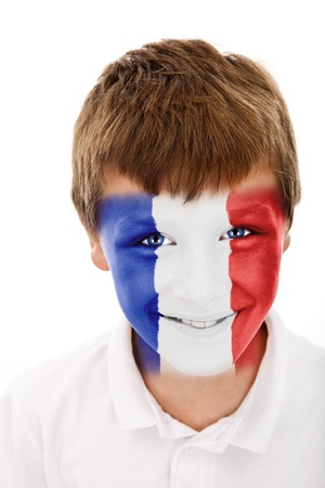 Young boy with france flag painted on his faceの写真素材
