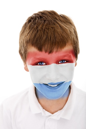 Young boy with luxembourg flag painted on his faceの写真素材