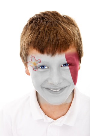 Young boy with malta flag painted on his faceの写真素材