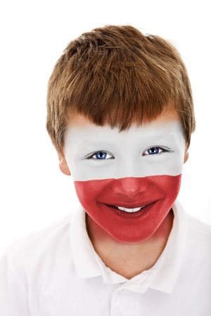 young boy with poland flag painted on his faceの写真素材