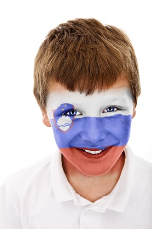 Young boy with ..... (tu nazwa paÅstwa) flag painted on his faceの写真素材