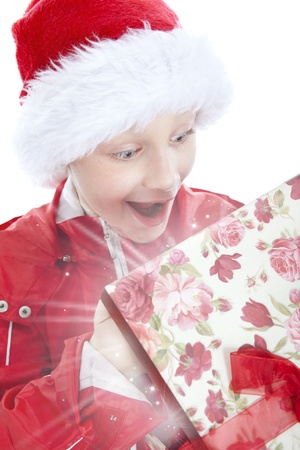surprised boy opening present over white backgroundの写真素材