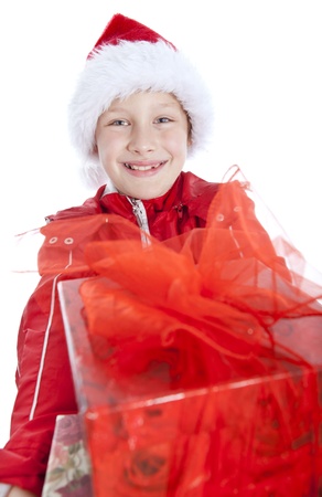 smiling boy holding present over white backgroundの写真素材
