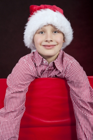 smiling christmas boy in present boxの写真素材