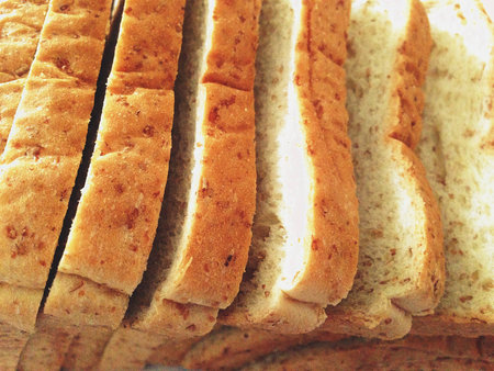Fresh whole wheat bread placed on a white background.の写真素材