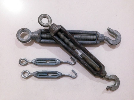 Stainless steel turnbuckle on a white background.の写真素材