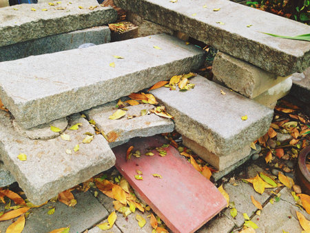 Old benches are made of broken mortar and put in piles to put away.の写真素材