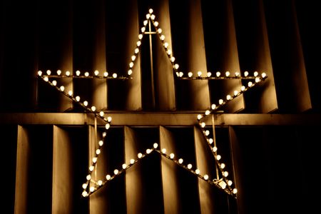 Christmas star on the building facadeの写真素材