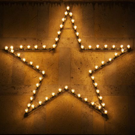 Christmas star on the building facadeの写真素材