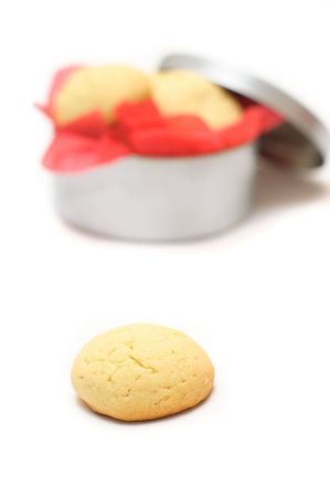 Cookies in a round box with a red paper napkinの写真素材