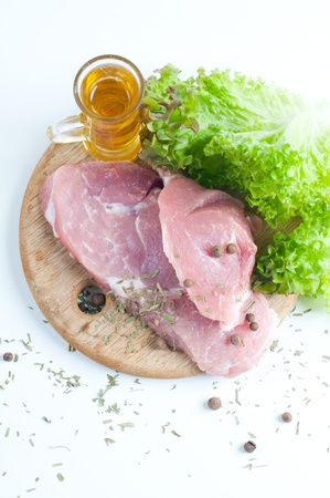 Fresh raw meat with spices and herbsの写真素材