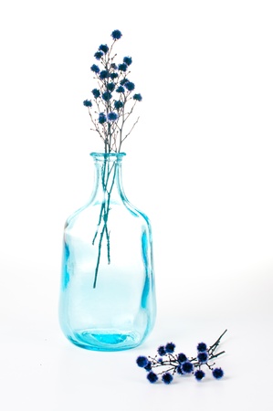 Vintage blue glass bottle on a white backgroundの写真素材