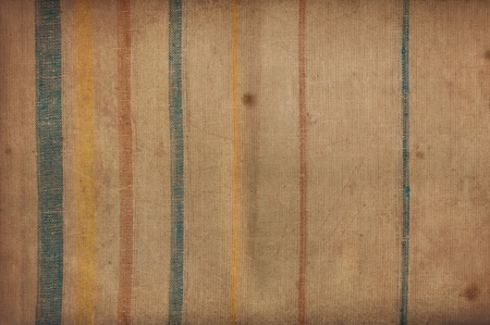 Vintage texture of an old striped fabric stainedの写真素材