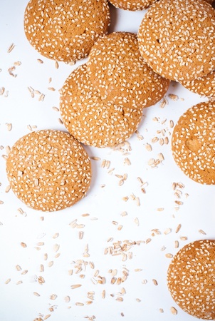 Arrangement of cookies with sesame seeds on a white backgroundの写真素材