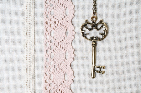 Vintage key, natural linen fabric and exquisite handmade laceの写真素材