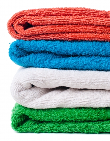 A stack of towels close-up on white backgroundの写真素材