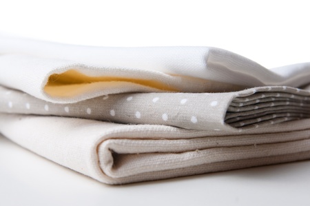 stack of new fabrics in different colors and textures, close-upの写真素材