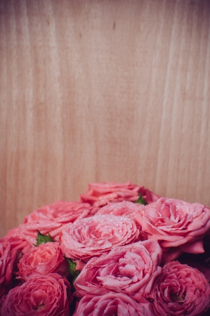 Bouquet of bright fresh pink roses in vintage style, faded colorsの写真素材