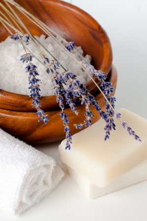 Products for bath, SPA, wellness and hygiene: natural soap, lavender, sea salt, candles and a towel, close-up.の写真素材