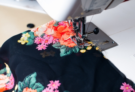 Machine sewing: a close-up sewing machine, needle, thread and silk fabric, close-upの写真素材