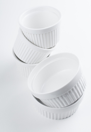 White empty clean ceramic bakeware on a white background, cooking utensils