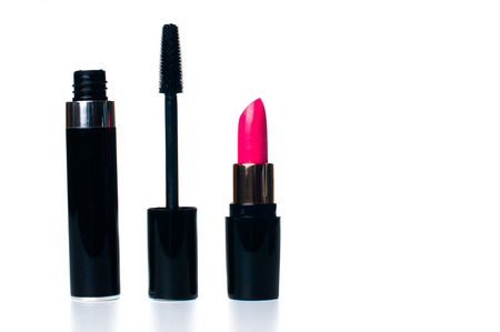 Cosmetic and makeup set: open lipstick and mascara on white background, isolatedの写真素材