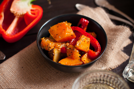 Healthy vegetarian food of roasted vegetables, peppers, potatoes and pumpkinの写真素材