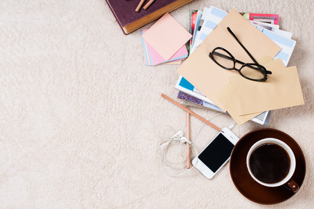Student life: books, textbooks, magazines, notebooks, coffee and glasses on the floor, preparing for exams.の写真素材