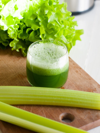 Freshly squeezed juice of fresh cucumber and celery, detox diet, vegan foodの写真素材