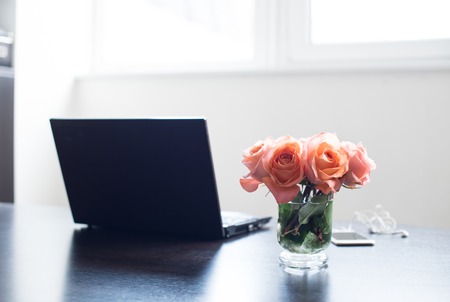 Light room interior, bouquet of fresh spring flowers on a table. Home interior decor.の写真素材