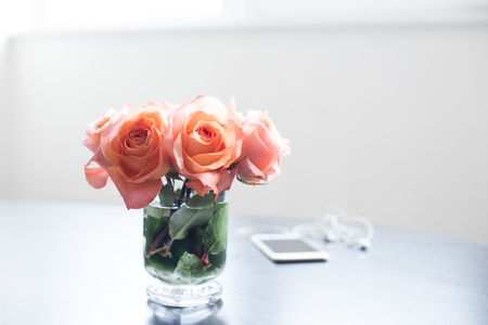 Light room interior, bouquet of fresh spring flowers on a table. Home interior decor.の写真素材