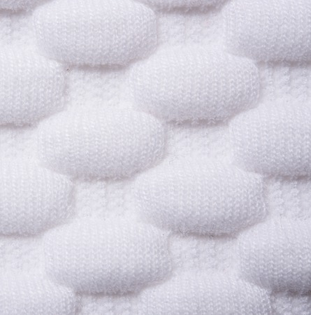 White knitted fabric macro shot, cloth textureの写真素材