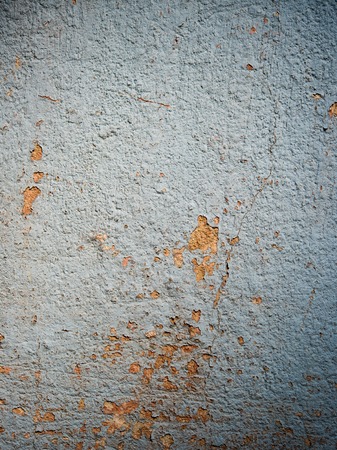 Texture of old pale blue colored cracked plaster abstract backgroundの写真素材