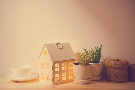 Beautiful vintage home decorations: flowers and decorative objects on the shelf by the wall. House decor background.の写真素材