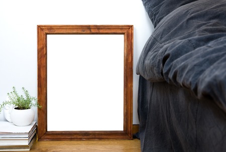 Empty blank vintage wooden frame on a floor, home bedroom interior decor, painting art poster mock-upの写真素材