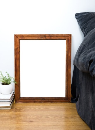 Empty blank vintage wooden frame on a floor, home bedroom interior decor, painting art poster...