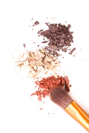 Makeup brushes set and loose powder eyeshadows isolated on white background,  cosmetic tools macro shotの写真素材